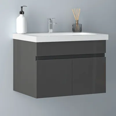 A modern bathroom vanity with a sink, faucet, soap dispenser, and diffuser.