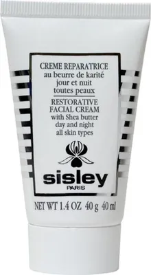 A white tube of Sisley Restorative Facial Cream with black and white striped detailing.