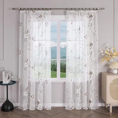 Imagen del producto de Cortina translúcida Unyqoos® con estampado floral, con cinta para confeccionar pliegues y ojales, 100% poliéster, 140 x 225 cm, ideal como cortina ligera para proteger la privacidad en salones y dormitorios
