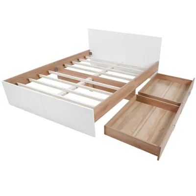 A disassembled wooden and white bed frame with two drawers pulled out.
