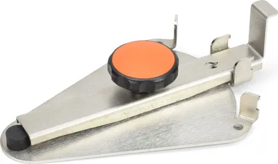 A metal bracket with an orange knob, likely for holding a fire plate.