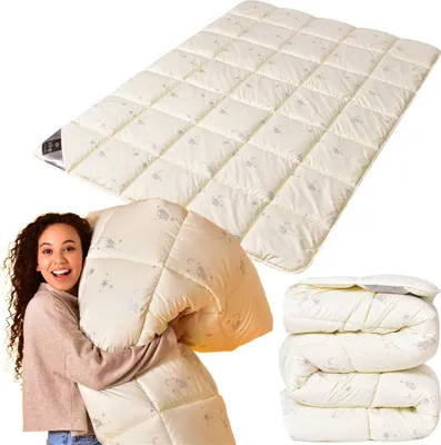 A woman is holding a folded duvet, with a spread-out duvet and folded duvets in the background.