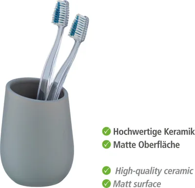 A gray ceramic toothbrush holder with two toothbrushes inside, set against a white background. Text describing product features is present on the right side.