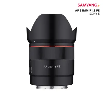 A studio shot of a camera lens on a white background.