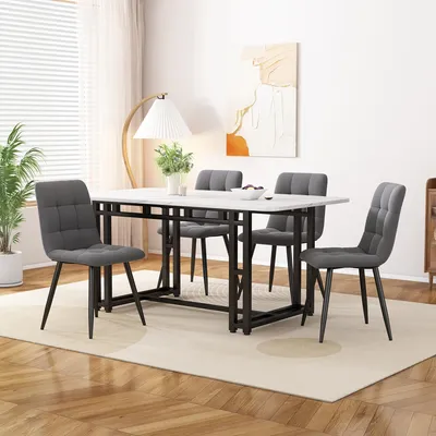 A dining table and chairs set in a well-lit room with a large window and artwork on the wall.