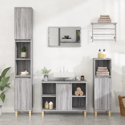 A bathroom vanity set with cabinets, a sink, and a mirror.