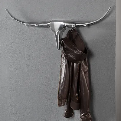 Produktbild von cagü: Design Wandgarderobe Garderobe Stierschädel [ARIZONA] mit 4 Haken Silber aus poliertem Aluminium 100cm Länge inkl. Befestigungsmaterial, Echter Designklassiker!