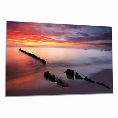 Produktbild von Wallario Herdabdeckplatte aus Glas, Größe 90 x 52 cm 1-teilig, Motiv Sandstrand im Sonnenuntergang - Roter Himmel