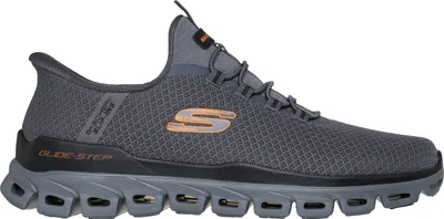 A side view of a single gray Skechers shoe against a white background.