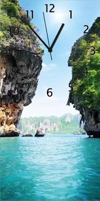 Produktbild von Wallario Design Wanduhr Felsenschlucht am Meer in Thailand aus Echtglas, Größe 30 x 60 cm
