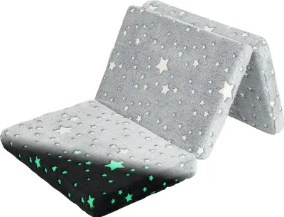A folded mattress with a star pattern, some stars glow in the dark.