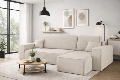 A modern living room with a beige sectional sofa, coffee table, and decor.