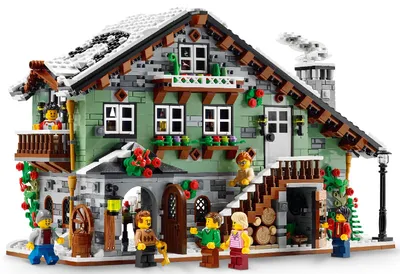 A LEGO model of a winter cabin with people.