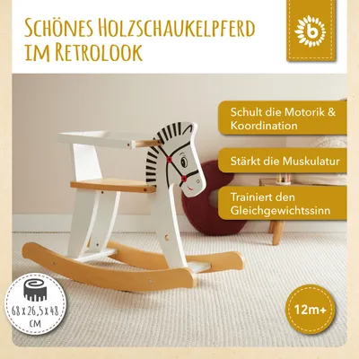 A white and black wooden rocking horse with wooden rockers, placed on a textured carpet.