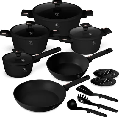 A collection of black cookware and kitchen utensils arranged on a white background.