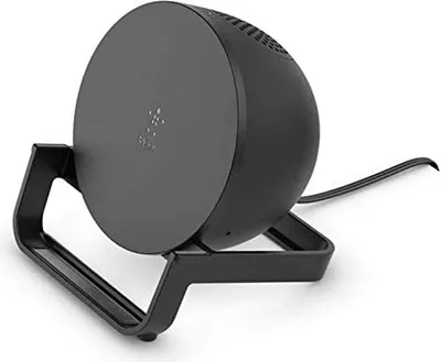 A black wireless charging stand is shown on a white background.