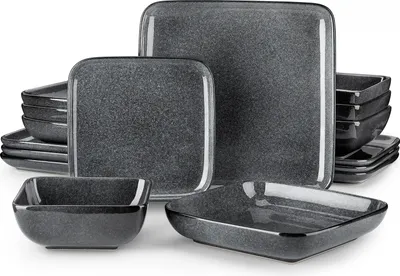 A set of dark gray speckled ceramic dishes, including plates and bowls, arranged on a white background.
