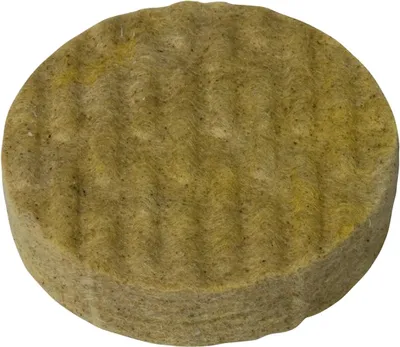 A single, round, textured object, likely a building material or insulation product, is shown against a white background.