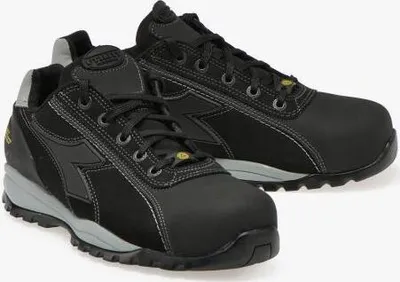 A pair of black Diadora work shoes.