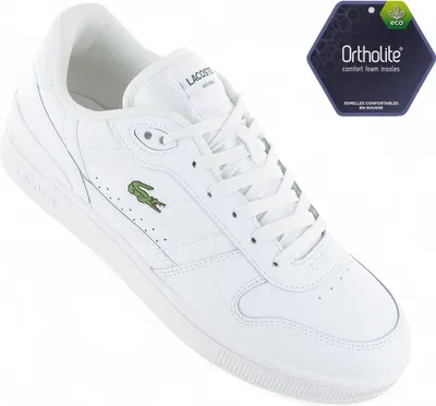 A white Lacoste sneaker is shown from a side-angle against a white background. A hexagonal tag with 'Ortholite' branding is visible in the upper right corner.