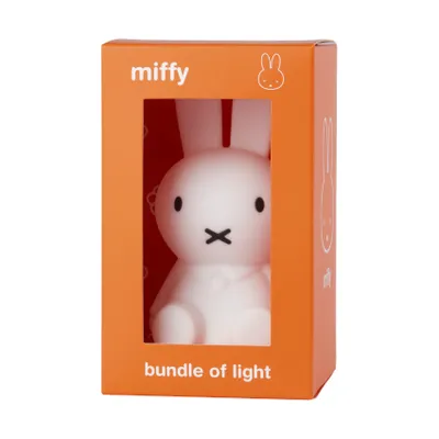 A Miffy lamp in its orange packaging.