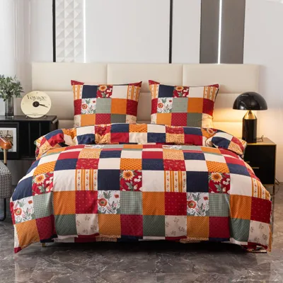 A neatly made bed with a patchwork quilt and pillows, set against a headboard and bedside tables.