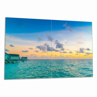 Produktbild von Wallario Herdabdeckplatte aus Glas, Größe 80 x 52 cm 2-teilig, Motiv Wasserhäuser auf den Malediven