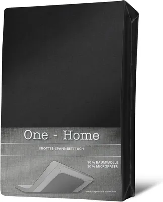A black fitted sheet is presented in its packaging, with branding and material information displayed on the front.