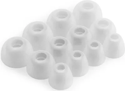 A collection of white silicone earbud tips arranged in a cluster on a white background.