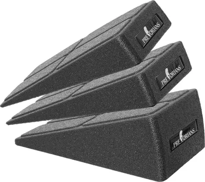 Three black slant boards stacked on a white background.