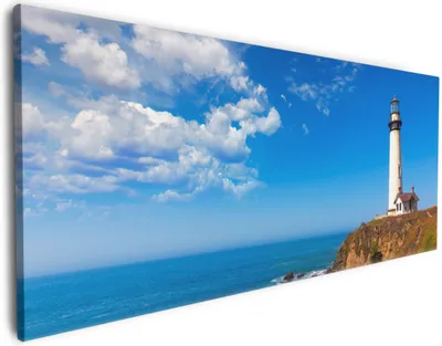 Produktbild von Wallario Premium Leinwandbild Leuchtturm auf einem Felsvorsprung - Blauer Himmel in Größe 60 x 150 cm