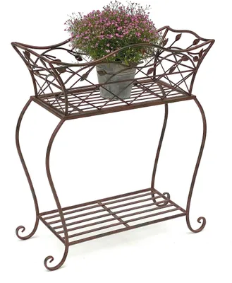 A brown metal plant stand with a potted plant on the top shelf.