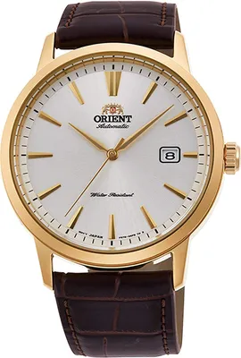 A close-up studio shot of a gold-toned men's watch with a white dial and a brown leather strap.