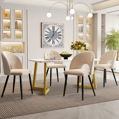 A dining room set with a rectangular table and four chairs, set in a well-lit room with decorative elements.