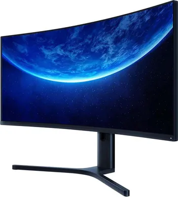 A black curved gaming monitor on a white background, displaying a blue planet in space.
