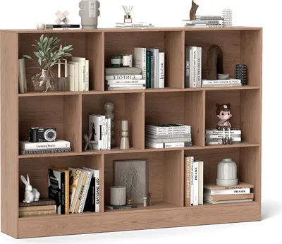 A well-lit studio shot of a wooden bookshelf filled with various decorative items and books.
