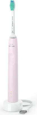 A pink electric toothbrush with a white charging base and USB cable, presented against a white background.