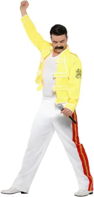 A man dressed in a Freddie Mercury costume, holding a microphone and striking a pose.