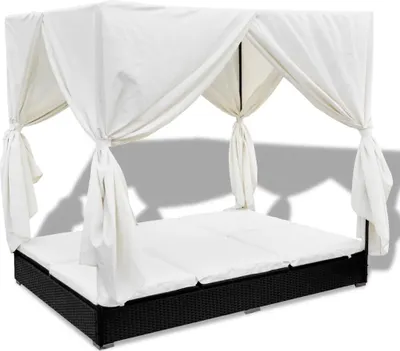 An outdoor lounge bed with a white canopy and curtains.