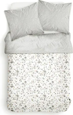 A top-down view of a bedding set laid out on a white surface.