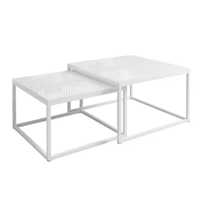 Two white nesting coffee tables on a white background.