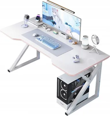 A white gaming desk with a computer, monitor, keyboard, and accessories.
