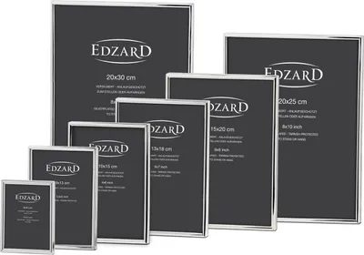 A collection of silver-colored picture frames of various sizes arranged on a black background.