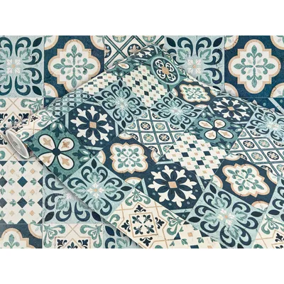 A roll of wallpaper with a blue and white tiled pattern.
