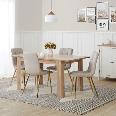 A dining room scene with a table and chairs.