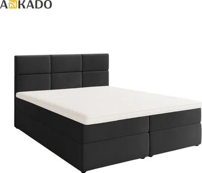 A dark grey boxspring bed with a white mattress and topper, shown from a three-quarter angle against a white background.