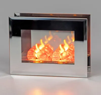 A decorative LED fireplace with a silver frame and glowing orange and yellow flames.