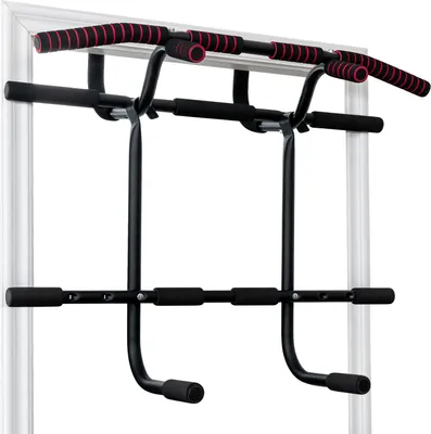 A black pull-up bar with red and black grips is mounted in a doorway.