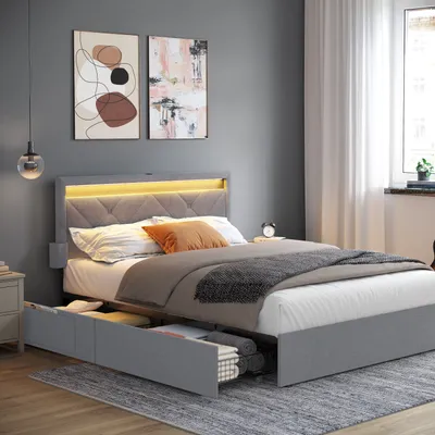 A bedroom scene featuring a bed with storage drawers and LED lighting.