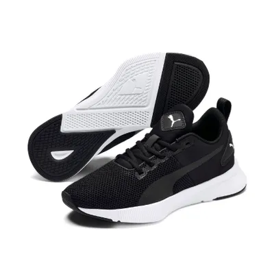 A pair of black Puma running shoes with white soles and accents, shown from a slightly elevated side angle.